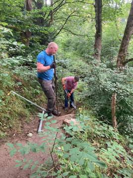 Further work on the steps up the banking by the sluice gate on the River Holme